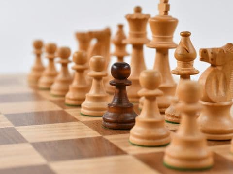 Chess pieces on the board — strategy before confrontation
