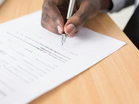 Signing the terms of a settlement agreement