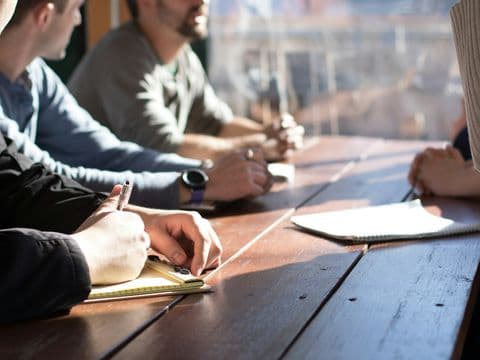 A professional meeting in progress in a bright office
