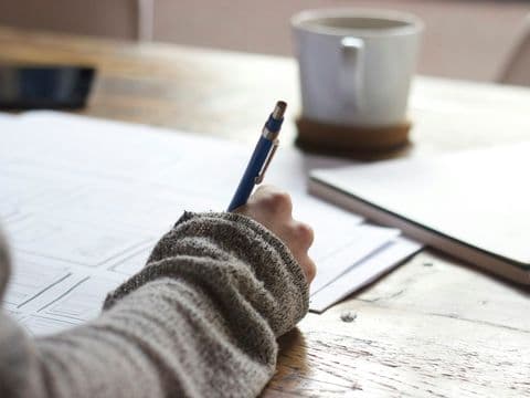 Preparation notes and coffee on a desk the week before mediation