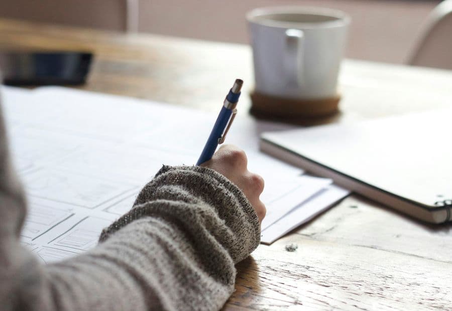 Preparation notes and coffee on a desk the week before mediation