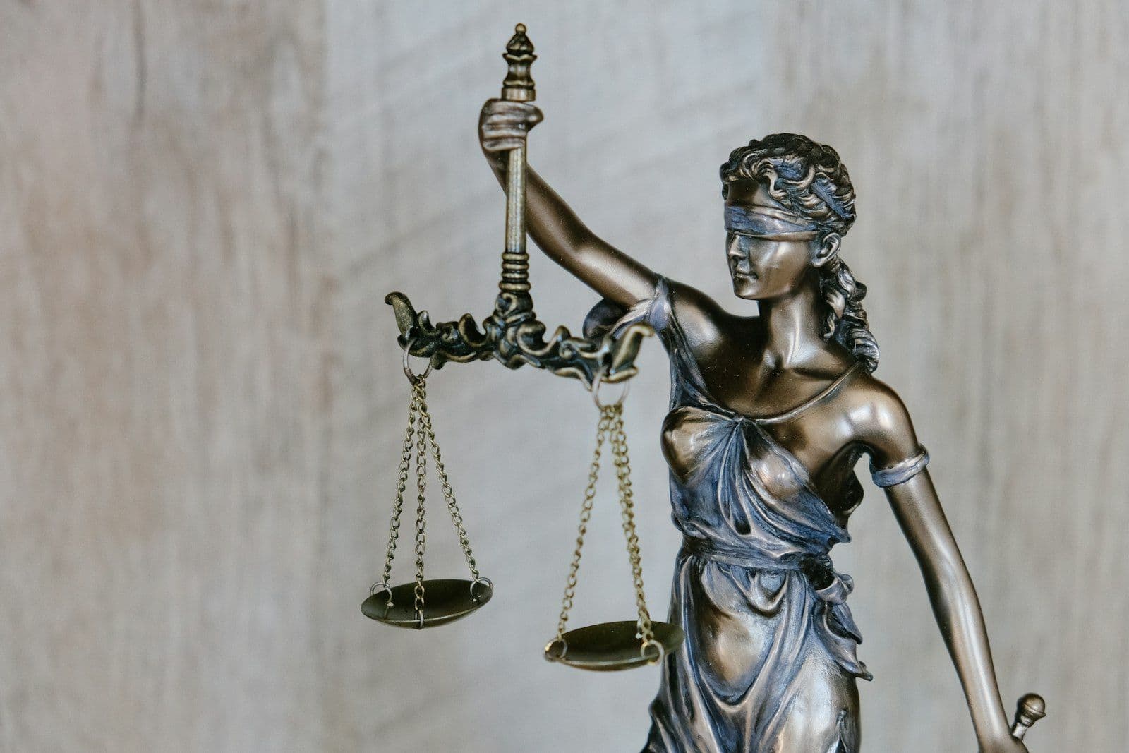 The figure of Lady Justice holding the scales